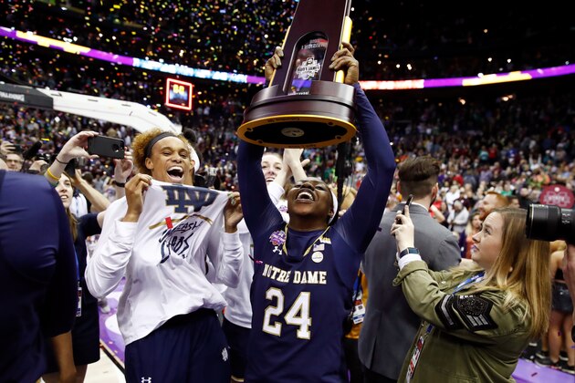 COLUMBUS, OH - APRIL 01:  Arike Ogunbowale #24 of the Notre Dame Fighting Irish hoists the NCAA championship trophy after scoring the game winning basket to defeat the Mississippi State Lady Bulldogs in the championship game of the 2018 NCAA Women's Final Four at Nationwide Arena on April 1, 2018 in Columbus, Ohio. The Notre Dame Fighting Irish defeated the Mississippi State Lady Bulldogs 61-58.  (Photo by Andy Lyons/Getty Images)