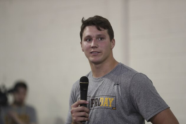 University of Wyoming quarterback Josh Allen (17) speaks with the media after his drill session at Pro Day March 23, 2018 in Laramie, Wyo. (AP Photo/Margaret Bowles)