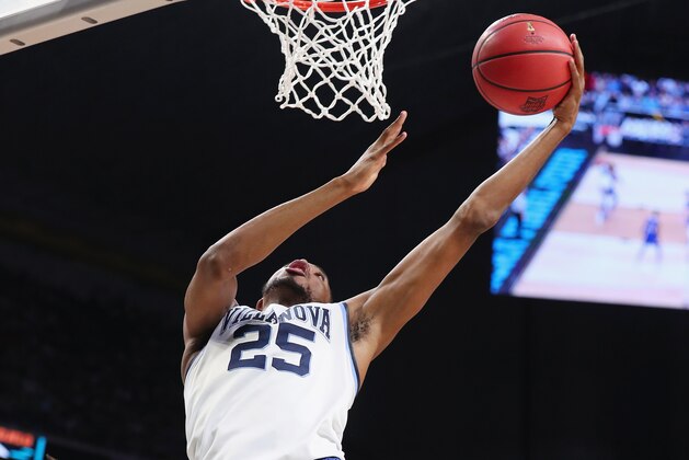 SAN ANTONIO, TX - MARCH 31: Mikal Bridges #25 of the Villanova Wildcats drives to the basket in the second half against Devonte' Graham #4 of the Kansas Jayhawks during the 2018 NCAA Men's Final Four Semifinal at the Alamodome on March 31, 2018 in San Antonio, Texas. (Photo by Tom Pennington/Getty Images) SAN ANTONIO, TX - MARCH 31: Mikal Bridges #25 of the Villanova Wildcats drives to the basket in the second half against Devonte' Graham #4 of the Kansas Jayhawks during the 2018 NCAA Men's Final Four Semifinal at the Alamodome on March 31, 2018 in San Antonio, Texas. (Photo by Tom Pennington/Getty Images)