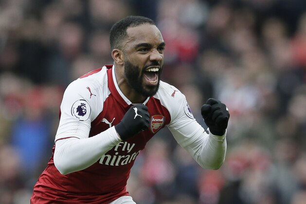 Arsenal's Alexandre Lacazette celebrates after scoring a penalty during the English Premier League soccer match between Arsenal and Stoke City at the Emirates Stadium in London, Sunday, April 1, 2018. (AP Photo/Tim Ireland)