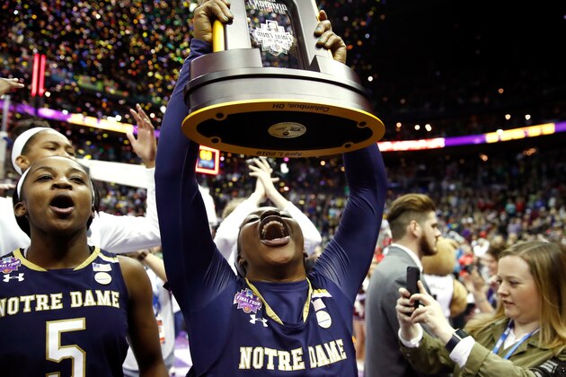 COLUMBUS, OH - APRIL 01:  Arike Ogunbowale #24 of the Notre Dame Fighting Irish hoist the NCAA championship trophy after scoring the game winning basket to defeat the Mississippi State Lady Bulldogs in the championship game of the 2018 NCAA Women's Final Four at Nationwide Arena on April 1, 2018 in Columbus, Ohio. The Notre Dame Fighting Irish defeated the Mississippi State Lady Bulldogs 61-58.  (Photo by Andy Lyons/Getty Images)