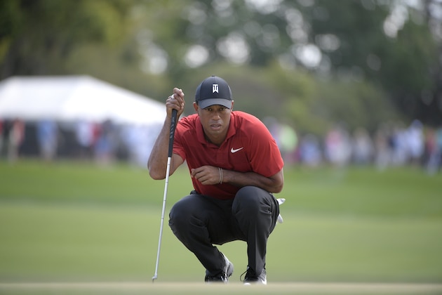 Tiger Woods lines up a putt on the second green during the final round of the Arnold Palmer Invitational golf tournament Sunday, March 18, 2018, in Orlando, Fla. (AP Photo/Phelan M. Ebenhack)