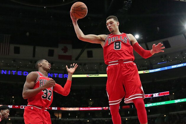 CHICAGO, IL - JANUARY 15:  Zach LaVine #8 of the Chicago Bulls rebounds over teammate Kris Dunn #32 against the Miami Heat at the United Center on January 15, 2018 in Chicago, Illinois. The Bulls defeated the Heat 199-111. NOTE TO USER: User expressly acknowledges and agrees that, by downloading and or using this photograph, User is consenting to the terms and conditions of the Getty Images License Agreement.  (Photo by Jonathan Daniel/Getty Images)