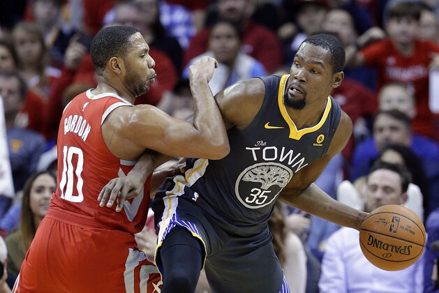 FILE - In this Jan. 20, 2018, file photo, Golden State Warriors forward Kevin Durant (35) looks to pass the ball under pressure from Houston Rockets guard Eric Gordon (10) during the second half of an NBA basketball game in Houston. AP basketball writer Tim Reynolds would pick Durant first in the draft for the NBA All-Star Game. (AP Photo/Michael Wyke, File)