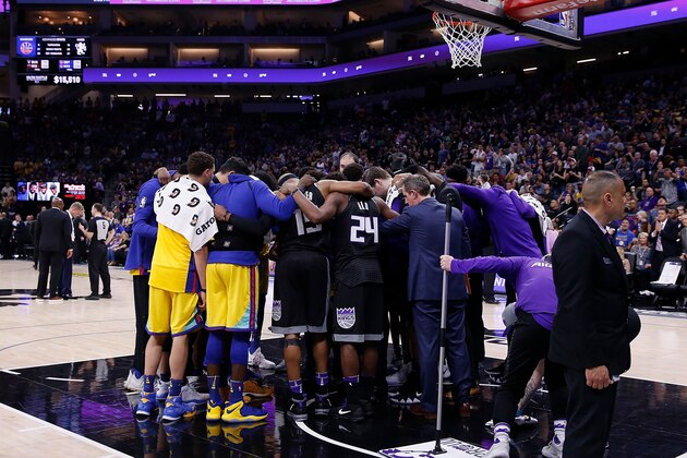 SACRAMENTO, CA - MARCH 31: Golden State Warriors and Sacramento Kings players come together to pray for Patrick McCaw #0 of the Golden State Warriors during the third quarter after McCaw was taken off the court on a stretcher during the game at Golden 1 Center on March 31, 2018 in Sacramento, California. NOTE TO USER: User expressly acknowledges and agrees that, by downloading and or using this photograph, User is consenting to the terms and conditions of the Getty Images License Agreement. (Photo by Lachlan Cunningham/Getty Images)