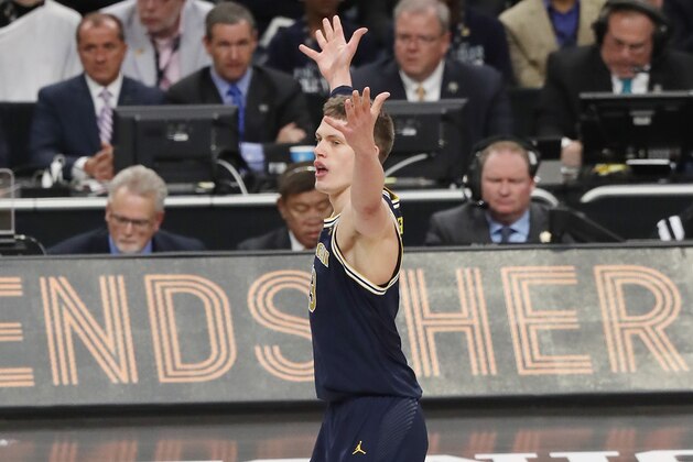 SAN ANTONIO, TX - APRIL 02: Moritz Wagner #13 of the Michigan Wolverines reacts after a play in the first half against the Villanova Wildcats during the 2018 NCAA Men's Final Four National Championship game at the Alamodome on April 2, 2018 in San Antonio, Texas.  (Photo by Chris Covatta/Getty Images)