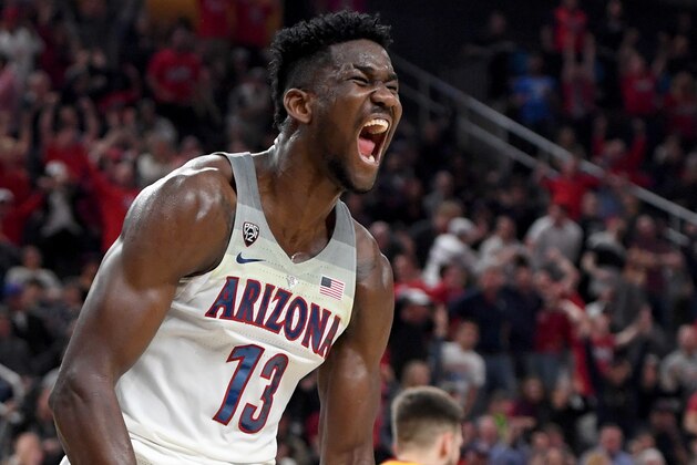 LAS VEGAS, NV - MARCH 10:  Deandre Ayton #13 of the Arizona Wildcats reacts after dunking against the USC Trojans during the championship game of the Pac-12 basketball tournament at T-Mobile Arena on March 10, 2018 in Las Vegas, Nevada. The Wildcats won 75-61.  (Photo by Ethan Miller/Getty Images)
