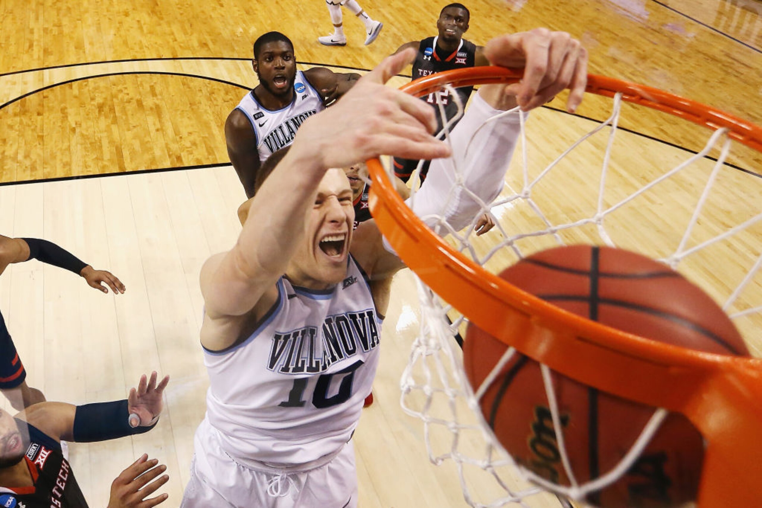 SAN ANTONIO, TX - APRIL 02: Donte DiVincenzo #10 of the Villanova Wildcats drives to the basket against Isaiah Livers #4 of the Michigan Wolverines in the first half during the 2018 NCAA Men's Final Four National Championship game at the Alamodome on April 2, 2018 in San Antonio, Texas.  (Photo by Ronald Martinez/Getty Images)