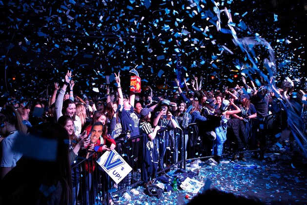 Fans cheer on the campus of Villanova University after the NCAA college basketball national championship game between Villanova and Michigan, Monday, April 2, 2018, in Villanova, Pa. Villanova won 79-62. (AP Photo/Laurence Kesterson)