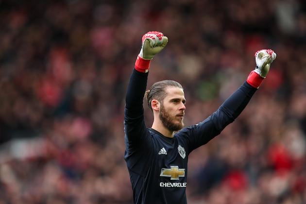 MANCHESTER, ENGLAND - MARCH 31: David de Gea of Manchester United celebrates the first goal during the Premier League match between Manchester United and Swansea City at Old Trafford on March 31, 2018 in Manchester, England. (Photo by Robbie Jay Barratt - AMA/Getty Images)