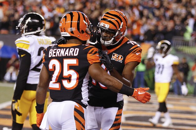 Cincinnati Bengals wide receiver A.J. Green, right, celebrates with running back Giovani Bernard (25) after scoring a touchdown in the first half of an NFL football game against the Pittsburgh Steelers, Monday, Dec. 4, 2017, in Cincinnati. (AP Photo/Gary Landers)