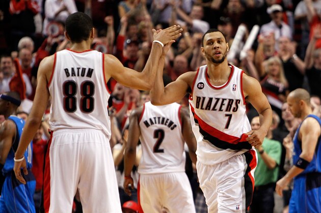 PORTLAND, OR - APRIL 23:  Brandon Roy #7 high fives Nicolas Batum #88 of the Portland Trail Blazers against the Dallas Mavericks in Game Four of the Western Conference Quarterfinals in the 2011 NBA Playoffs on April 23, 2011 at the Rose Garden in Portland, Oregon. NOTE TO USER: User expressly acknowledges and agrees that, by downloading and or using this photograph, User is consenting to the terms and conditions of the Getty Images License Agreement.  (Photo by Jonathan Ferrey/Getty Images)
