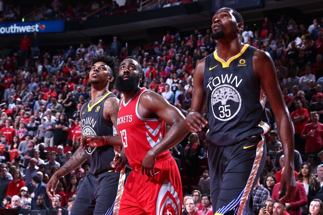 HOUSTON, TX - JANUARY 20:  Nick Young #6 and Kevin Durant #35 of the Golden State Warriors, and James Harden #13 of the Houston Rockets react to a play during the game on January 20, 2018 at the Toyota Center in Houston, Texas. NOTE TO USER: User expressly acknowledges and agrees that, by downloading and or using this photograph, User is consenting to the terms and conditions of the Getty Images License Agreement. Mandatory Copyright Notice: Copyright 2018 NBAE (Photo by Nathaniel Butler/NBAE via Getty Images)