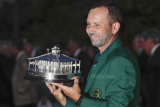 Sergio Garcia, of Spain, holds the winning trophy after winning the Masters golf tournament Sunday, April 9, 2017, in Augusta, Ga. (AP Photo/David J. Phillip)
