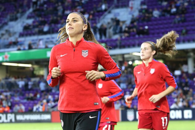 ORLANDO, FL - MARCH 07:  Alex Morgan #13 of United States runs onto the pitch prior to the SheBelieves Cup soccer match between United States and England at Orlando City Stadium on March 7, 2018 in Orlando, Florida. (Photo by Alex Menendez/ Getty Images)