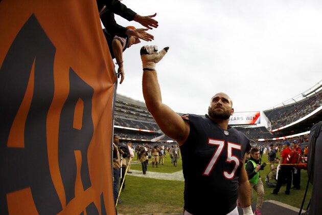 CHICAGO, IL - OCTOBER 22:   Kyle Long #75 of the Chicago Bears high fives fans after the Bears defeated the Carolina Panthers 17-3 at Soldier Field on October 22, 2017 in Chicago, Illinois.  (Photo by Wesley Hitt/Getty Images)