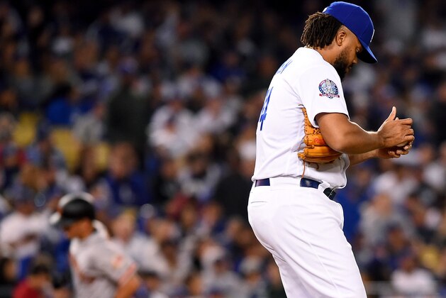 LOS ANGELES, CA - MARCH 30: Kenley Jansen #74 of the Los Angeles Dodgers walks on the mound as Joe Panik #12 of the San Francisco Giants rounds third after hitting a solo home run in the ninth inning of the game  at Dodger Stadium on March 30, 2018 in Los Angeles, California.  (Photo by Jayne Kamin-Oncea/Getty Images)