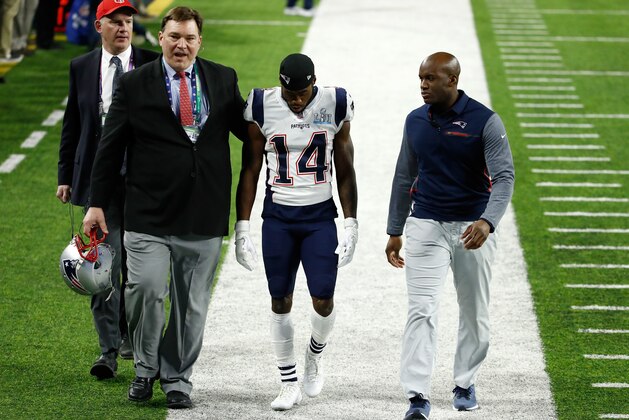 MINNEAPOLIS, MN - FEBRUARY 04:  Brandin Cooks #14 of the New England Patriots is helped off the field by trainers after a hit against the Philadelphia Eagles during the second quarter in Super Bowl LII at U.S. Bank Stadium on February 4, 2018 in Minneapolis, Minnesota.  (Photo by Andy Lyons/Getty Images)