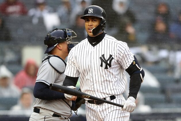 NEW YORK, NY - APRIL 03:  Giancarlo Stanton #27 of the New York Yankees strikes out in the third inning against the Tampa Bay Rays during Opening Day at Yankee Stadium on April 3, 2018 in the Bronx borough of New York City.  (Photo by Elsa/Getty Images)