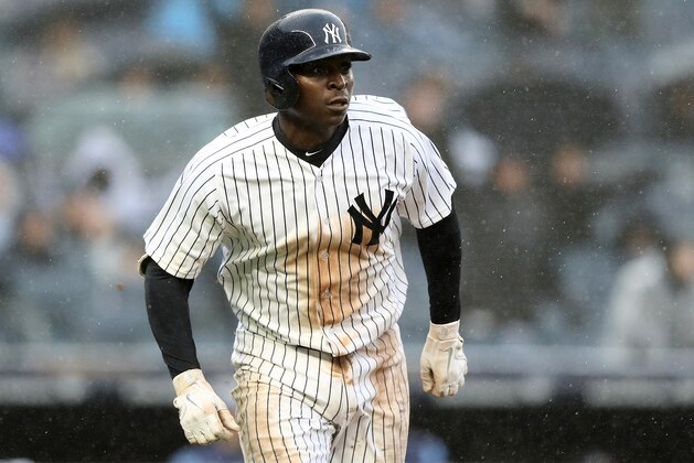 NEW YORK, NY - APRIL 03:  Didi Gregorius #18 of the New York Yankees watches his three run home run in the third inning against the Tampa Bay Rays during Opening Day at Yankee Stadium on April 3, 2018 in the Bronx borough of New York City.  (Photo by Elsa/Getty Images)