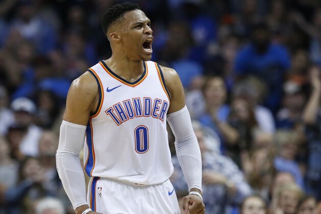 Oklahoma City Thunder guard Russell Westbrook shouts to the crowd in the first half of an NBA basketball game against the Denver Nuggets in Oklahoma City, Friday, March 30, 2018. (AP Photo/Sue Ogrocki)