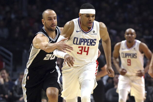 San Antonio Spurs guard Manu Ginobili (20) fouls Los Angeles Clippers forward Tobias Harris (34) during the first half of an NBA basketball game in Los Angeles on Tuesday, April 3, 2018. (AP Photo/Reed Saxon) San Antonio Spurs guard Manu Ginobili (20) fouls Los Angeles Clippers forward Tobias Harris (34) during the first half of an NBA basketball game in Los Angeles on Tuesday, April 3, 2018. (AP Photo/Reed Saxon)