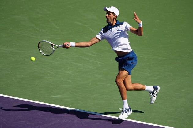 KEY BISCAYNE, FL - MARCH 23:  Novak Djokovic of Serbia plays a forehand against Benoit Paire of France in their second round match during the Miami Open Presented by Itau at Crandon Park Tennis Center on March 23, 2018 in Key Biscayne, Florida.  (Photo by Clive Brunskill/Getty Images)