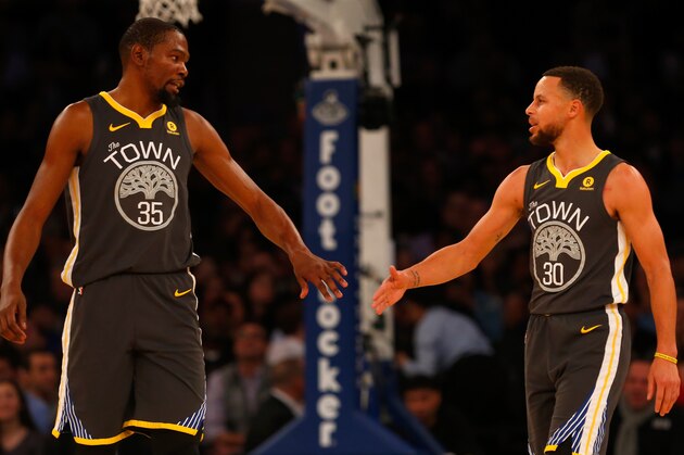 NEW YORK, NY - FEBRUARY 26:  (NEW YORK DAILIES OUT)    Stephen Curry #30 and Kevin Durant #35 of the Golden State Warriors in action against the New York Knicks at Madison Square Garden on February 26, 2018 in New York City. The Warriors defeated the Knicks 125-111. NOTE TO USER: User expressly acknowledges and agrees that, by downloading and/or using this Photograph, user is consenting to the terms and conditions of the Getty Images License Agreement.  (Photo by Jim McIsaac/Getty Images)