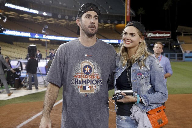Houston Astros' Justin Verlander celebrates with Kate Upton after Game 7 of baseball's World Series against the Los Angeles Dodgers Wednesday, Nov. 1, 2017, in Los Angeles. The Astros won 5-1 to win the series 4-3. (AP Photo/Jae C. Hong)
