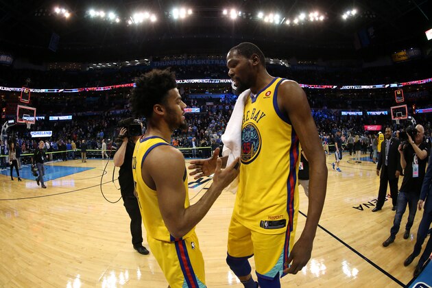 OKLAHOMA CITY, OK - APRIL 3:  Kevin Durant #35 of the Golden State Warriors and Quinn Cook #4 of the Golden State Warriors high-five after the game against the Oklahoma City Thunder on April 3, 2018 at Chesapeake Energy Arena in Oklahoma City, Oklahoma. NOTE TO USER: User expressly acknowledges and agrees that, by downloading and or using this photograph, User is consenting to the terms and conditions of the Getty Images License Agreement. Mandatory Copyright Notice: Copyright 2018 NBAE (Photo by Layne Murdoch/NBAE via Getty Images)