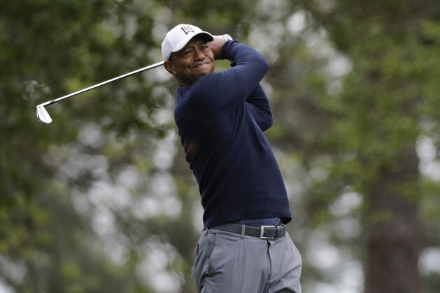 Tiger Woods hits a shot on the fourth hole during a practice round for the Masters golf tournament Wednesday, April 4, 2018, in Augusta, Ga. (AP Photo/David J. Phillip)