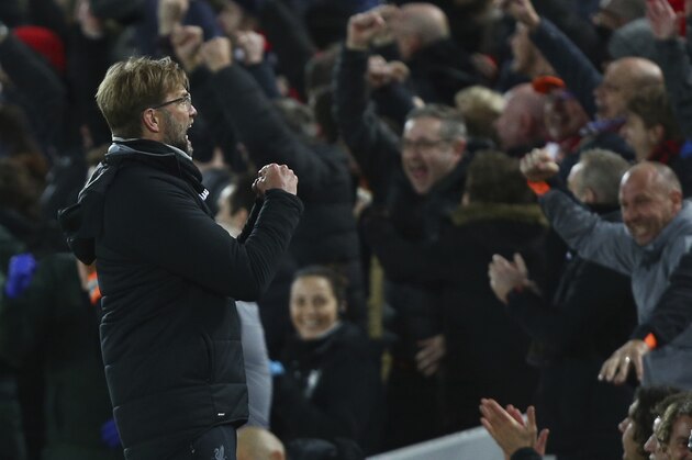 Liverpool coach Juergen Klopp celebrates as his team scores during the Champions League quarter final first leg soccer match between Liverpool and Manchester City at Anfield stadium in Liverpool, England, Wednesday, April 4, 2018. (AP Photo/Dave Thompson)