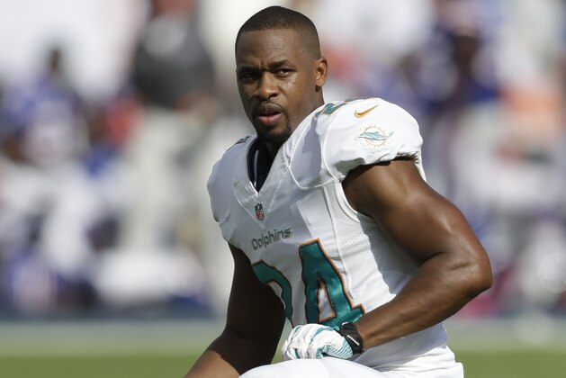Miami Dolphins cornerback Dimitri Patterson (24) rests on the field during the second half of an NFL football game against the Buffalo Bills, Sunday, Oct. 20, 2013, in Miami Gardens, Fla. (AP Photo/Wilfredo Lee)
