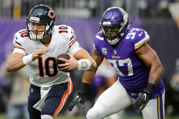 MINNEAPOLIS, MN - DECEMBER 31: Mitchell Trubisky #10 of the Chicago Bears scrambles with the ball against Everson Griffen #97 of the Minnesota Vikings during the game on December 31, 2017 at U.S. Bank Stadium in Minneapolis, Minnesota. (Photo by Hannah Foslien/Getty Images)