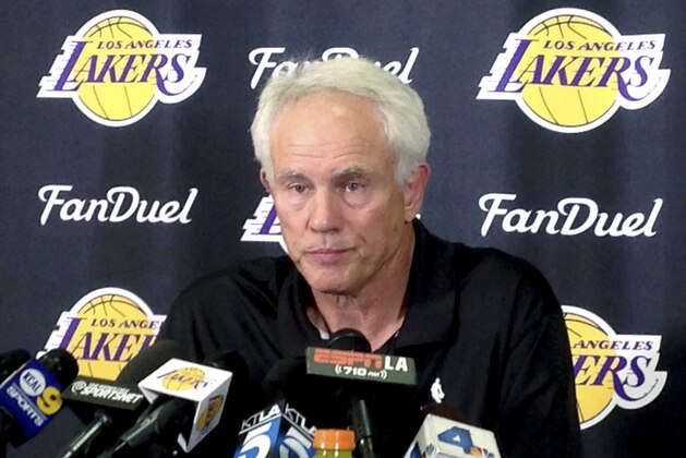 FILE - April 15, 2016 file photo Los Angeles Lakers general manager Mitch Kupchak speaks to reporters at team headquarters in El Segundo, Calif. The Los Angeles Lakers fired Kupchak Tuesday, Feb. 21, 2017, and put Magic Johnson in charge of basketball operations in a major shake-up of the struggling franchise's front office. (AP Photo/Greg Beacham, File)