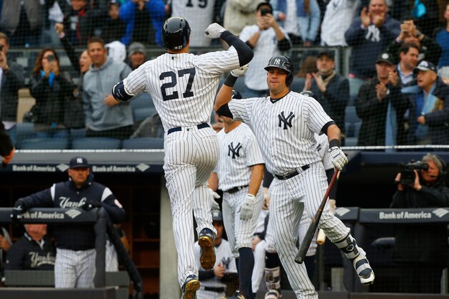 NEW YORK, NY - APRIL 04:  Giancarlo Stanton #27 of the New York Yankees celebrates his first inning two run home run against the Tampa Bay Rays with teammate Gary Sanchez #24 at Yankee Stadium on April 4, 2018 in the Bronx borough of New York City.  (Photo by Jim McIsaac/Getty Images)