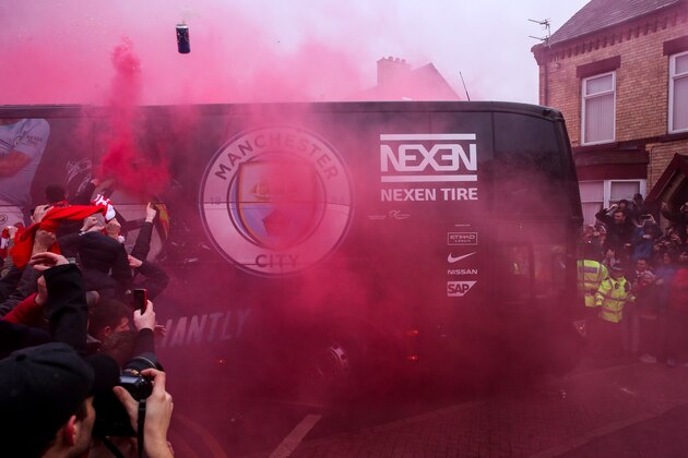 LIVERPOOL, ENGLAND - APRIL 04: Fans of Liverpool react and throw objects as the Manchester City team bus arrives prior to the UEFA Champions League Quarter Final first leg match between Liverpool and Manchester City at Anfield on April 4, 2018 in Liverpool, England. (Photo by Robbie Jay Barratt - AMA/Getty Images) LIVERPOOL, ENGLAND - APRIL 04: Fans of Liverpool react and throw objects as the Manchester City team bus arrives prior to the UEFA Champions League Quarter Final first leg match between Liverpool and Manchester City at Anfield on April 4, 2018 in Liverpool, England. (Photo by Robbie Jay Barratt - AMA/Getty Images)