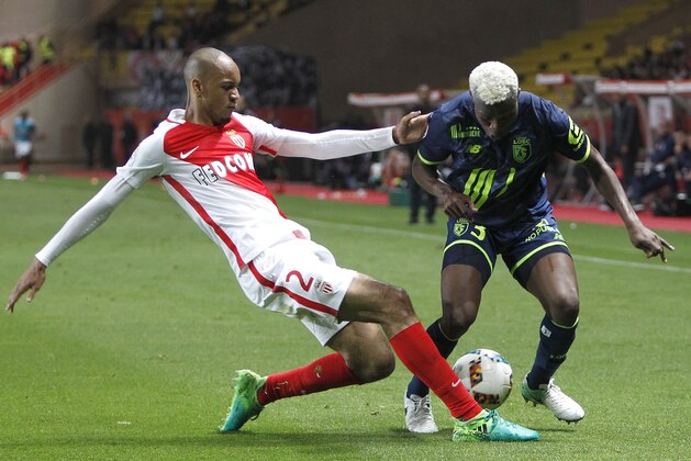 Monaco's Fabio Henrique Tavares Fabinho, left, challenges for the ball with Lille's Youssouf Kone during a League One soccer match between Monaco and Lille, at the Louis II stadium, in Monaco, Sunday, May, 14 2017. (AP Photo/Claude Paris)