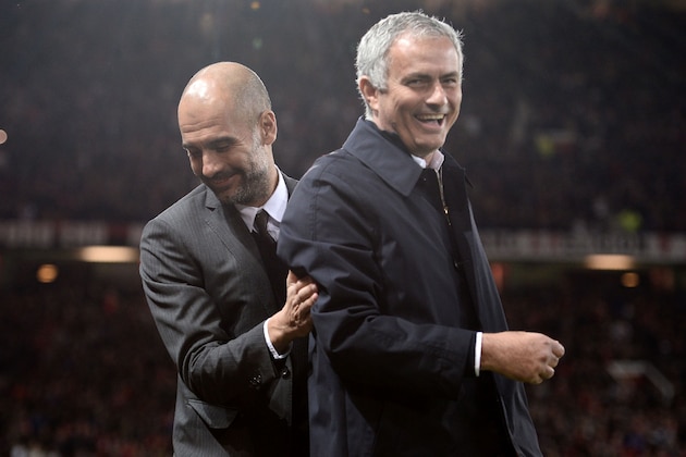 Manchester United's Portuguese manager Jose Mourinho (R) and Manchester City's Spanish manager Pep Guardiola share a joke ahead of the EFL (English Football League) Cup fourth round match between Manchester United and Manchester City at Old Trafford in Manchester, north west England on October 26, 2016. / AFP / Oli SCARFF / RESTRICTED TO EDITORIAL USE. No use with unauthorized audio, video, data, fixture lists, club/league logos or 'live' services. Online in-match use limited to 75 images, no video emulation. No use in betting, games or single club/league/player publications.  /         (Photo credit should read OLI SCARFF/AFP/Getty Images)