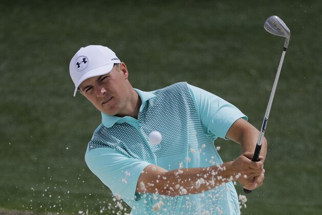 Jordan Spieth hits from a bunker on the 18th hole during a practice round for the Masters golf tournament Wednesday, April 4, 2018, in Augusta, Ga. (AP Photo/David J. Phillip)