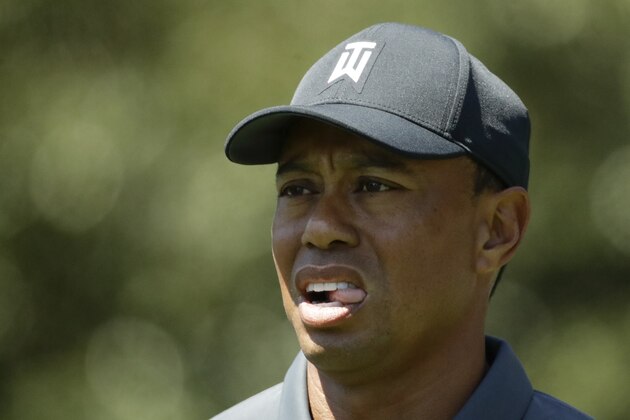 Tiger Woods reacts on the ninth hole during the first round at the Masters golf tournament Thursday, April 5, 2018, in Augusta, Ga. (AP Photo/Chris Carlson)
