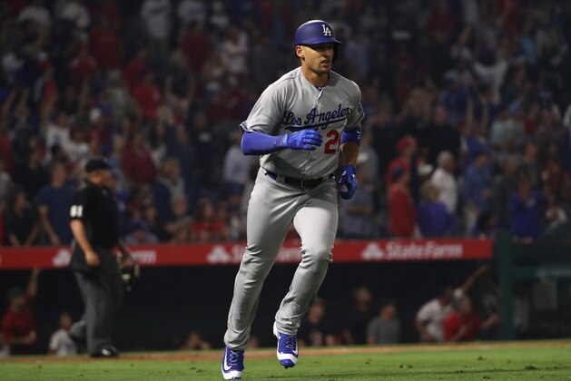ANAHEIM, CA - JUNE 28:  Trayce Thompson #21 of the Los Angeles Dodgers jogs to first base after hitting a solo homerun during the eighth inning of the MLB game the Los Angeles Angels of Anaheim at Angel Stadium of Anaheim on June 28, 2017 in Anaheim, California. The Angels defeated the Dodgers 3-2.  (Photo by Victor Decolongon/Getty Images)