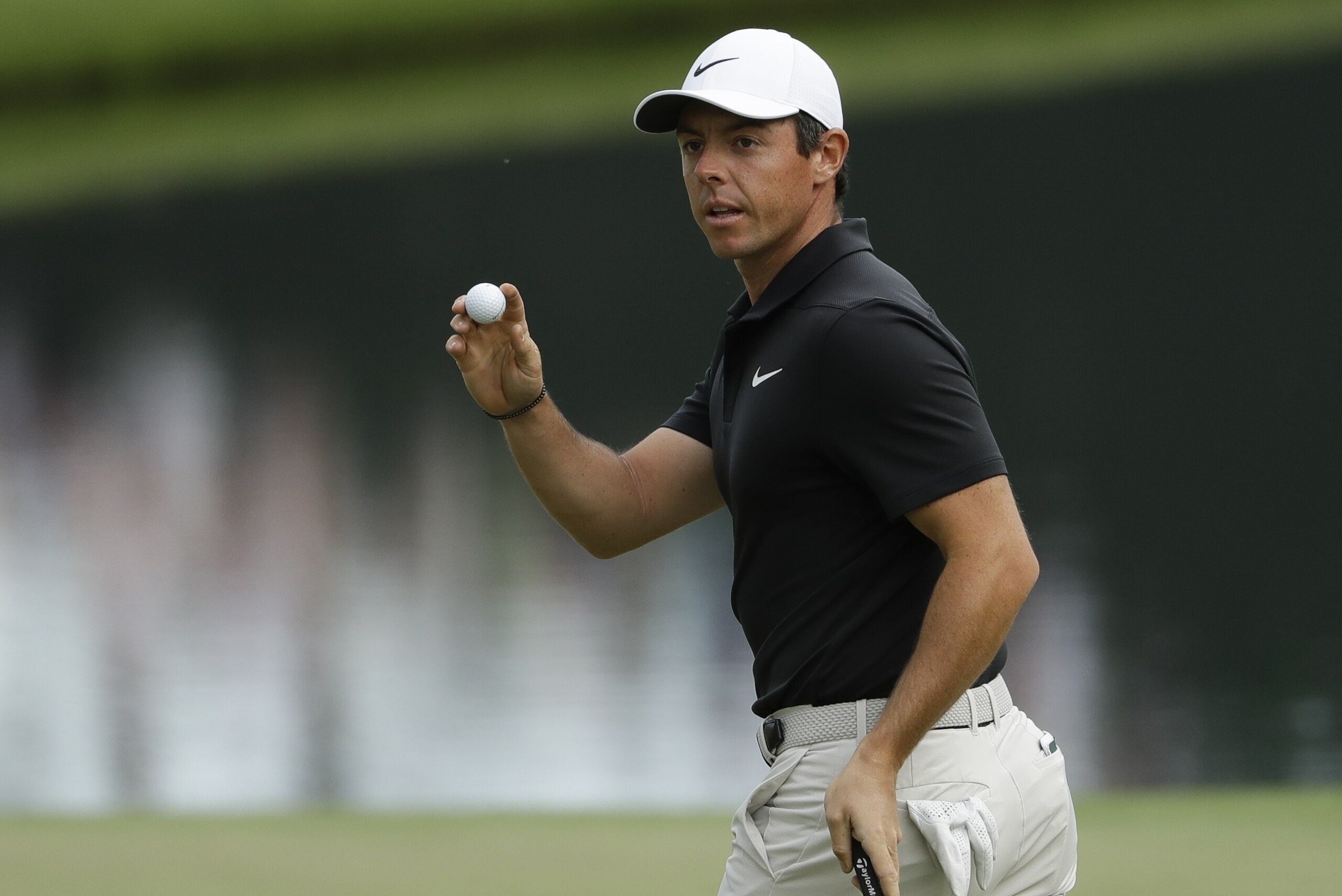 Rory McIlroy, of Northern Ireland, reacts after putting on the 16th hole during the first round at the Masters golf tournament Thursday, April 5, 2018, in Augusta, Ga. (AP Photo/Matt Slocum)