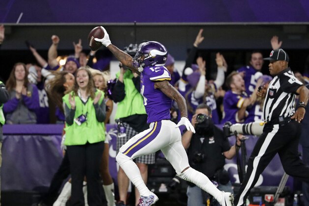 Minnesota Vikings wide receiver Stefon Diggs (14) runs in for a game winning touchdown against the New Orleans Saints during the second half of an NFL divisional football playoff game in Minneapolis, Sunday, Jan. 14, 2018. The Vikings defeated the Saints 29-24. (AP Photo/Jeff Roberson)