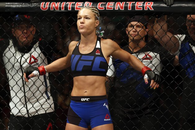 Felice Herrig stretches before fighting Kailin Curran during a women's strawweight mixed martial arts bout at United Center in Chicago, Saturday, July 23, 2016. (AP Photo/Nam Y. Huh)