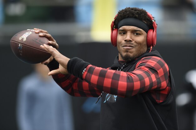 Carolina Panthers' Cam Newton warms up before an NFL football game against the Green Bay Packers in Charlotte, N.C., Sunday, Dec. 17, 2017. (AP Photo/Mike McCarn)