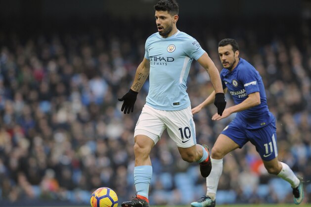 Manchester City's Sergio Aguero, left, and Chelsea's Pedro run for the ball during the English Premier League soccer match between Manchester City and Chelsea at the Etihad Stadium in Manchester, England, Sunday, March 4, 2018. (AP Photo/Rui Vieira)