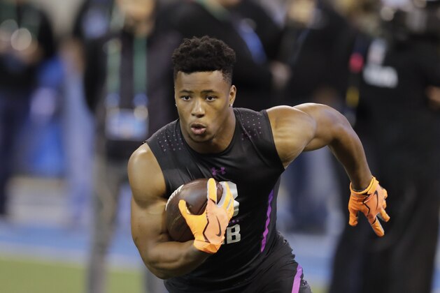 Penn State running back Saquon Barkley runs a drill during the NFL football scouting combine, Friday, March 2, 2018, in Indianapolis. (AP Photo/Darron Cummings)