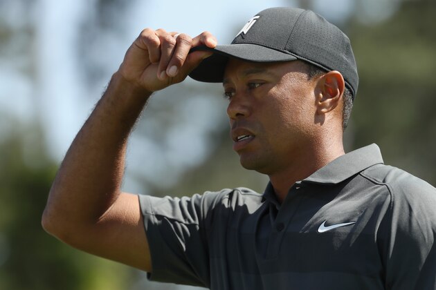 AUGUSTA, GA - APRIL 05:  Tiger Woods of the United States walks of the 18th green during the first round of the 2018 Masters Tournament at Augusta National Golf Club on April 5, 2018 in Augusta, Georgia.  (Photo by Jamie Squire/Getty Images)