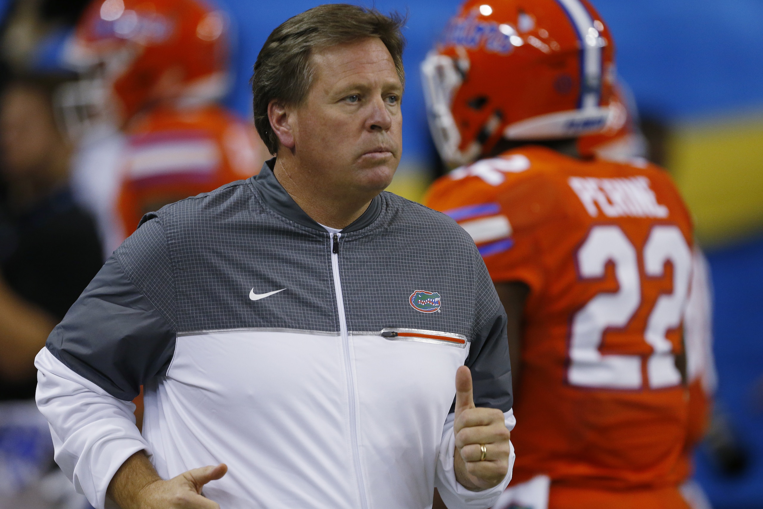 Florida head coach Jim McElwain runs out on the field before the first half of the Southeastern Conference championship NCAA college football game between Alabama and Florida, Saturday, Dec. 3, 2016, in Atlanta.(AP Photo/Butch Dill)